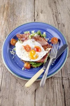 Breakfast with bacon and fried egg Stock Photos