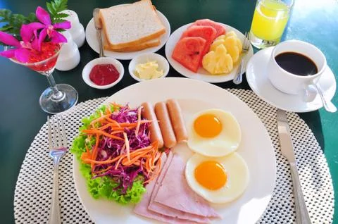 Breakfast with bacon fried egg and orange juice Stock Photos