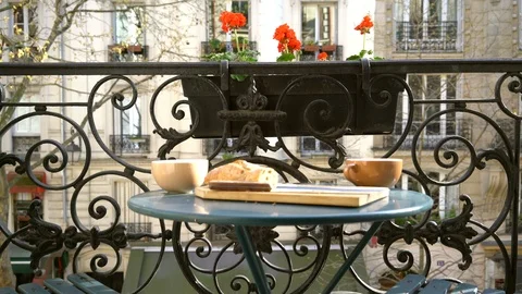 Breakfast on the balcony in Paris in Springtime with tilt down 库存影片 86408769