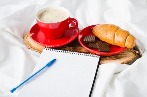 Breakfast in Bed and Empty Notebook for Note. Stock Photos