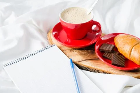 Breakfast in Bed and Empty Notebook for Note. Stock Photos
