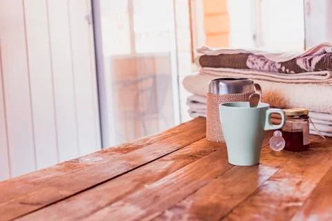 Breakfast in bed with blankets and cup on a wood. Stock Photos