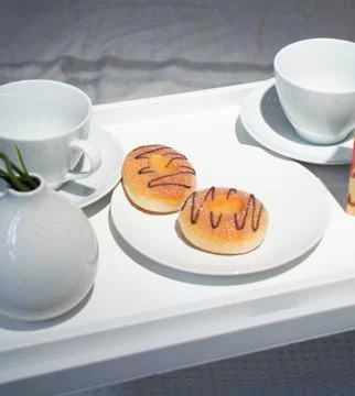 Breakfast in bed. Donuts for breakfast. Breakfast in bed at weekend Stock Photos