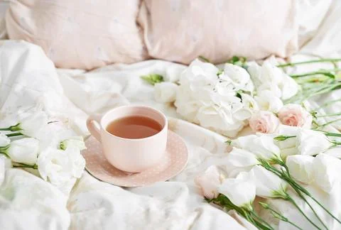 Breakfast in bed in hotel room. Accommodation. Breakfast in bed with tea cup  Stock Photos