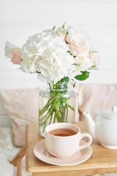 Breakfast in bed in hotel room. Accommodation. Breakfast in bed with tea cup  Stock Photos