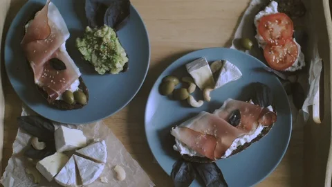 Breakfast in bed, tray with belgian waffles with blueberry and cup of lemon tea Stock Footage 85709138