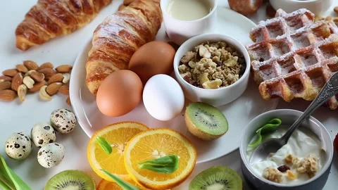 Breakfast with boiled eggs. Top view, rotation Stock Footage 130763580
