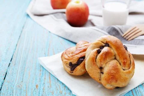 Breakfast with bread and apple and milk on wood table Stock Photos