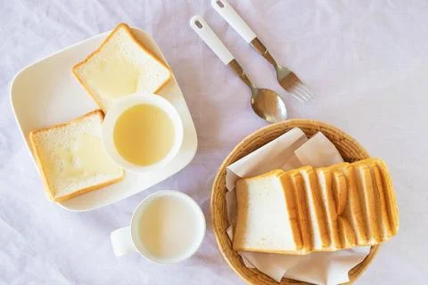 Breakfast, bread and milk on the table Stock Photos