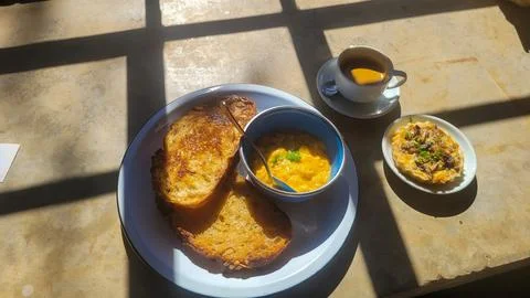 Breakfast with bread and scrambled eggs Stock Photos