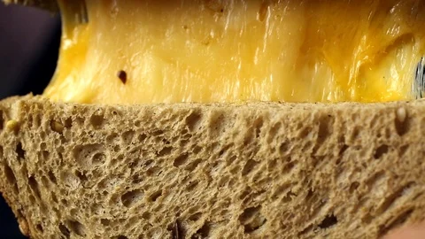 Breakfast bread with cheese on the kitchen table 스톡 동영상 104972957