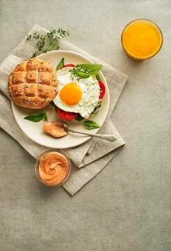 Breakfast with bread, egg and juice Stock Photos