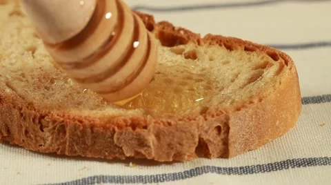 Breakfast - Bread with honey Stock Footage 10685867