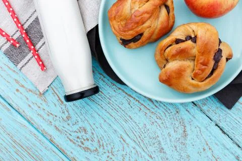 Breakfast with bread milk and apple on blue wood table Stock Photos