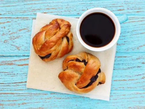 Breakfast with bread roll coffee on baking paper Stock Photos