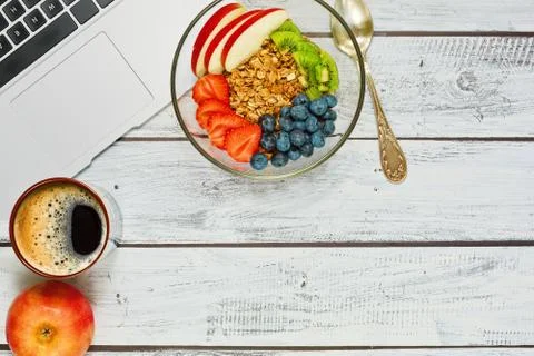 Breakfast break during the work with laptop Stock Photos