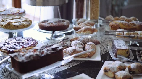 Breakfast buffet is offering wide range of bakery products, coffee and juice on Stock-Footage 94738061