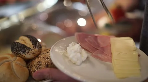 Breakfast Buffet self service with cheese, ham and buns on plate Stock Footage 66310285