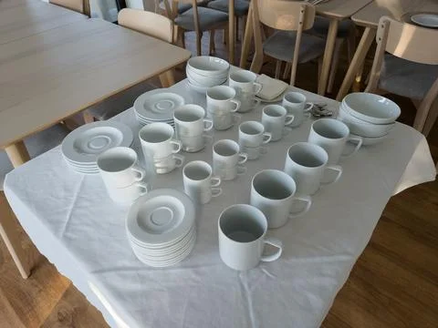 Breakfast buffet table set with clean tableware ready to use Stock Photos