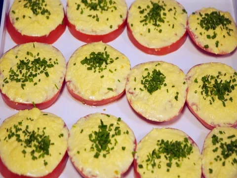 Breakfast buffet: tomatoes with cheese and herbs Video stock 82448925