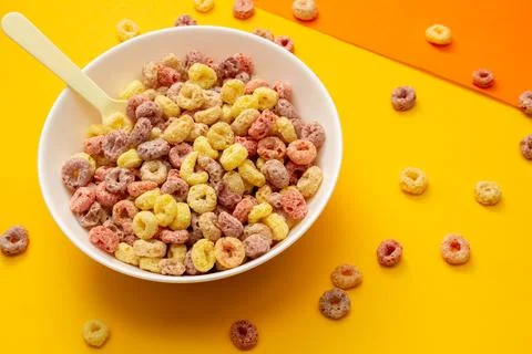 Breakfast cereal concept, Fruit ring cereal in bowl with wood spoon and fall  Stock Photos