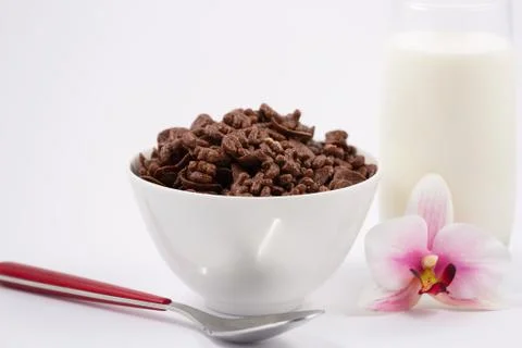 Breakfast cereal, cornflake chocolate in cups and milk is a healthy breakfast Stock Photos