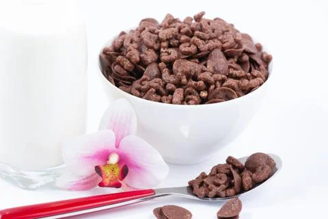 Breakfast cereal, cornflake chocolate in cups and milk is a healthy breakfast Stock Photos