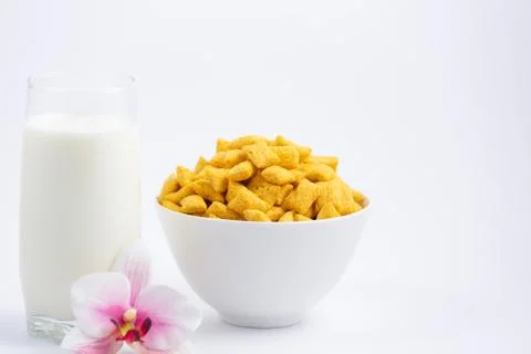 Breakfast cereal, cornflake, chocolate in cups and milk is a healthy breakfas Stock Photos