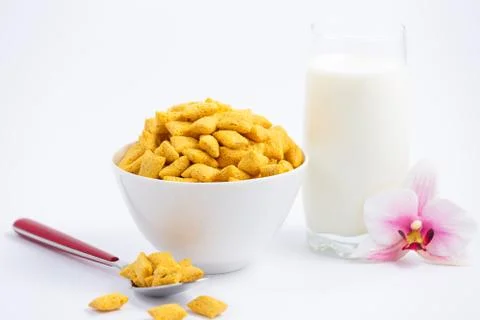 Breakfast cereal, cornflake, chocolate in cups and milk is a healthy breakfas Stock Photos