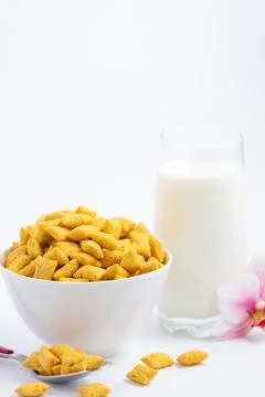 Breakfast cereal, cornflake, chocolate in cups and milk is a healthy breakfas Stock Photos