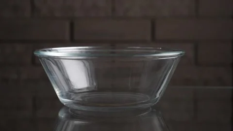 Breakfast with cereal falls on the plate Stock Footage 131849262