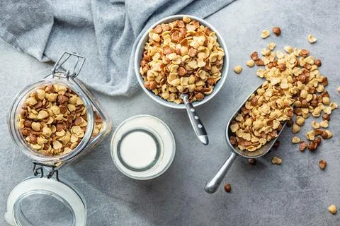 Breakfast cereal flakes on kitchen table. Stock Photos