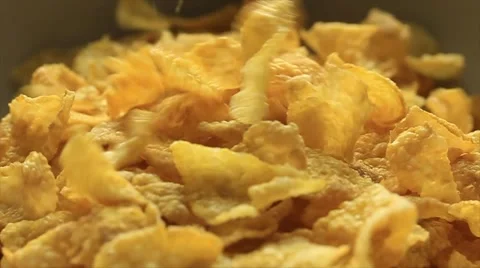 Breakfast Cereal Food Corn Flakes being poured into Bowl Video stock 47934097