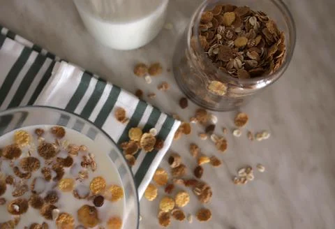 Breakfast cereal with milk on the table view from above. selectiv focus. Stock Photos