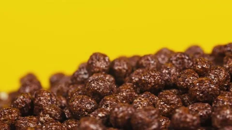 Breakfast cereals in the form of chocolate corn balls. Stock Footage 144527072