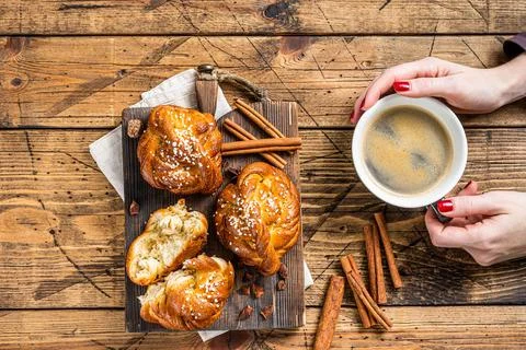 Breakfast with Cinnamon buns or rolls, Swedish Kanelbullar. wooden background Stock Photos