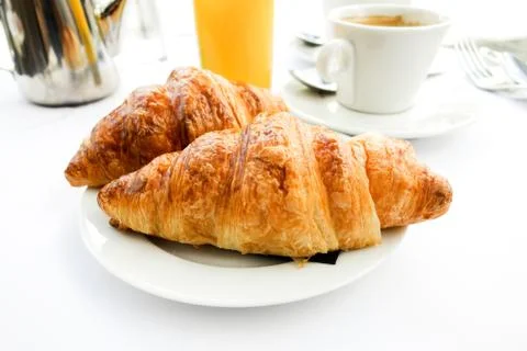 Breakfast with coffee and croissants Stock Photos