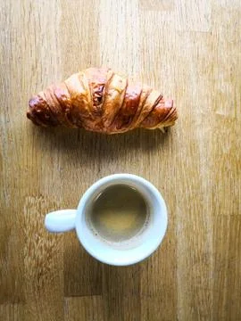 Breakfast with coffee and croissants on table Stock Photos