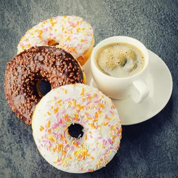 Breakfast with coffee and donuts Stock Photos