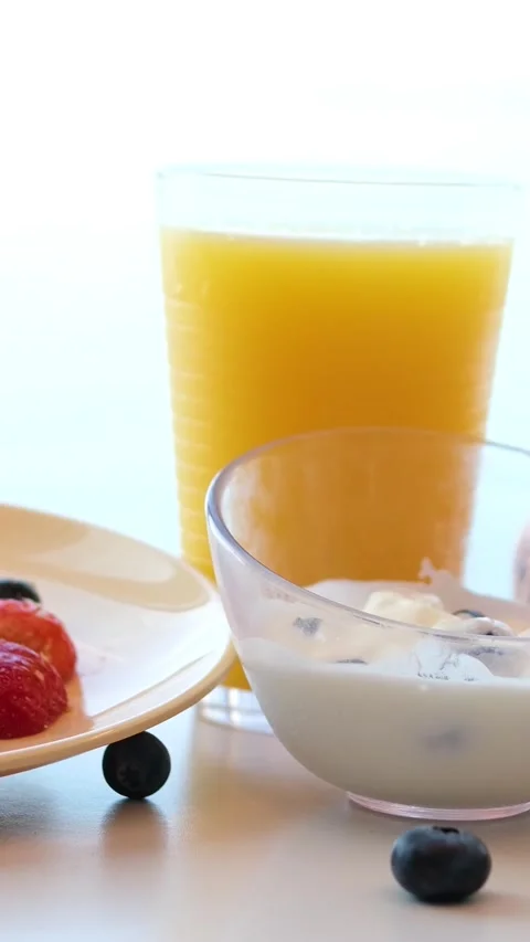 Breakfast with coffee cup, croissant, cereal, fruit and toast Stock Footage 317725024