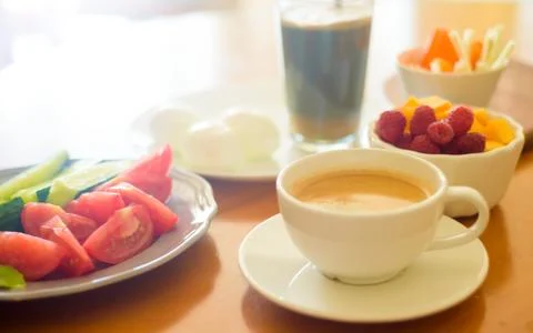 Breakfast with coffee, egg, vegetables and fruits Stock Photos