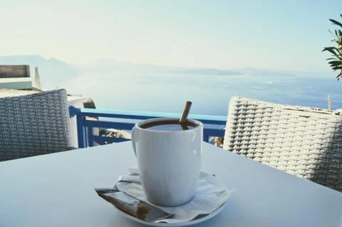 Breakfast coffee on an island with a view of the ocean. Stock Photos