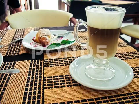 Breakfast with coffee latte macchiato and croissants Stock Photos