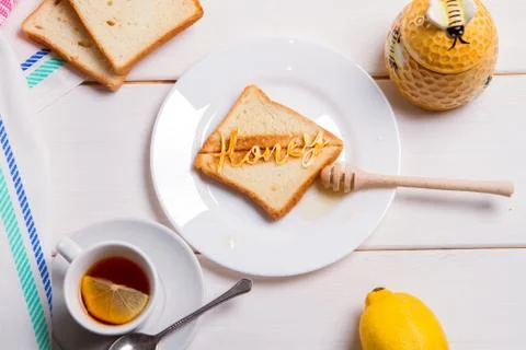 BREAKFAST CONCEPT fried bread toast with honey Stock Photos