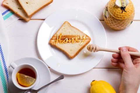 BREAKFAST CONCEPT fried bread toast with honey Stock Photos
