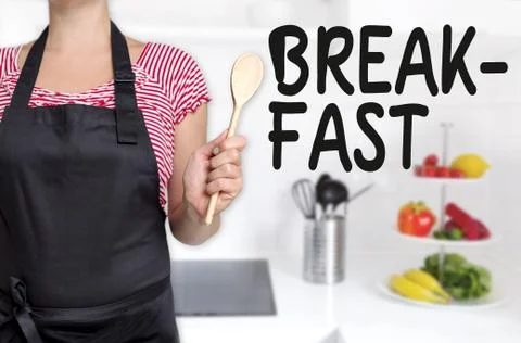 Breakfast cook holding wooden spoon concept Stock Photos