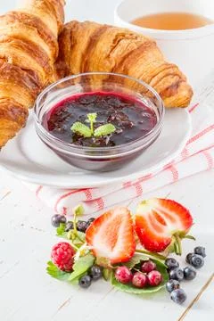 Breakfast croissants with straberry raspberry and blackberry tea jam Stock Photos