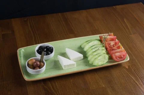 At breakfast, cucumber tomato cheese olive tray Stock Photos