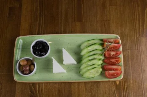 At breakfast, cucumber tomato cheese olive tray Stock Photos