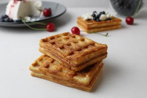 Breakfast delicious. snack two soft Belgian waffles lie on top of each other Stock Photos